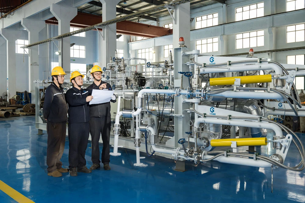 Hanlong engineering team reviewing loading system in workshop